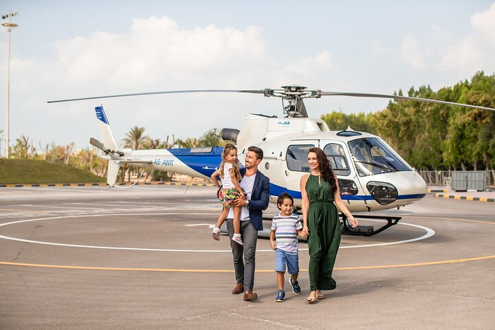 Experience Dubai from above with a unique 12-minute helicopter ride offering stunning views of iconic landmarks and creating unforgettable family memories during your travels.